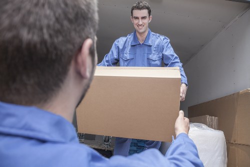 People moving boxes in Canary Wharf apartment building