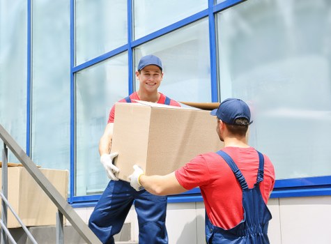 Removal team preparing for a safe move with packed boxes and protective materials