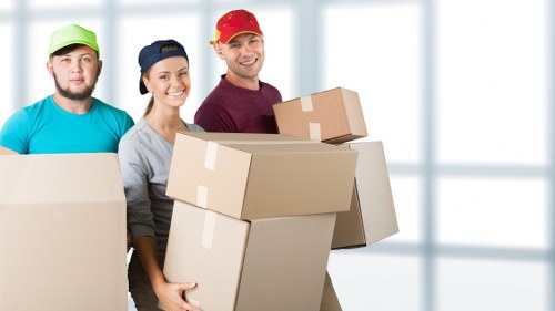 Professional office relocation team managing furniture and equipment transport