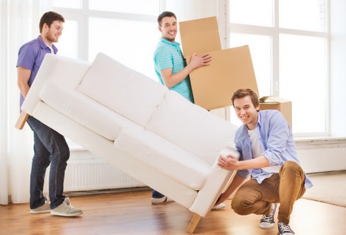 Student moving boxes prepared in a Canary Wharf apartment lobby