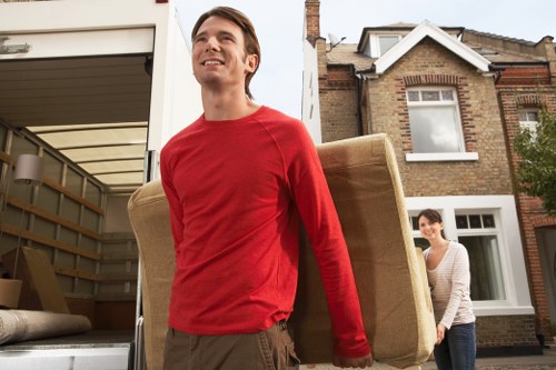 Professional movers handling furniture in Canary Wharf