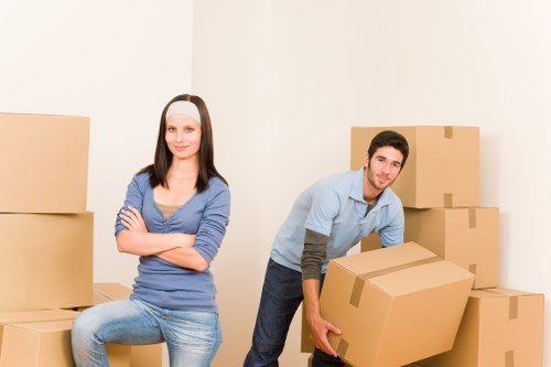 Expert movers handling fragile household items in Canary Wharf