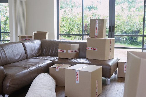 Canary Wharf furniture movers handling bulky items in a high-rise building
