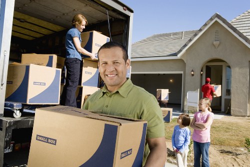 Loading furniture into a van for a Canary Wharf relocation